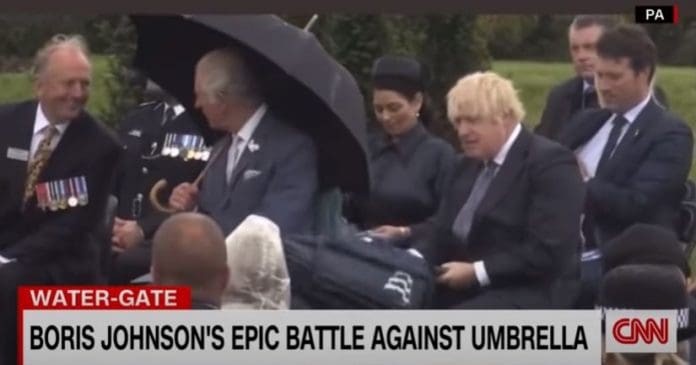 Boris Johnson's umbrella struggle makes Prince Charles laugh