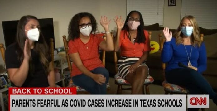 'I'm sending her to a warzone': Mother attacks Texas' mask mandate bans